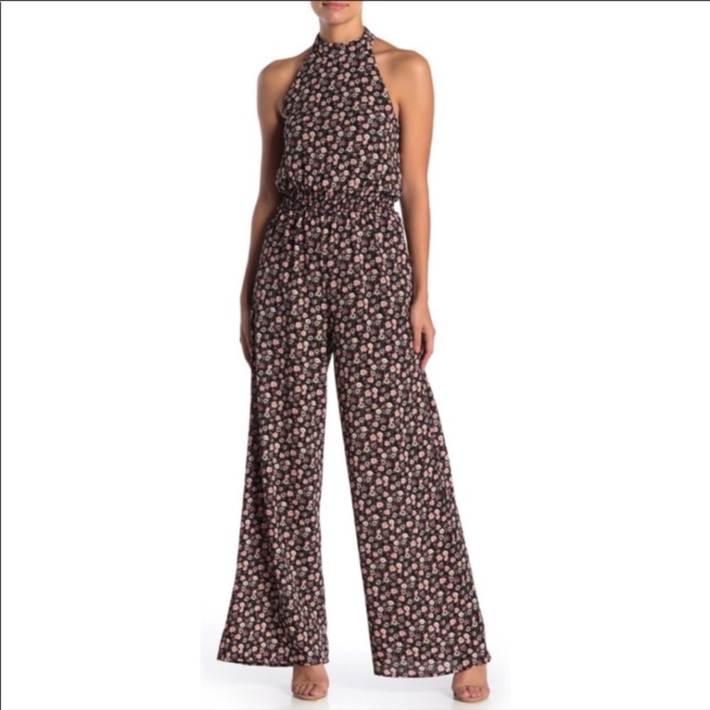 Black floral halter jumpsuit by Superfoxx